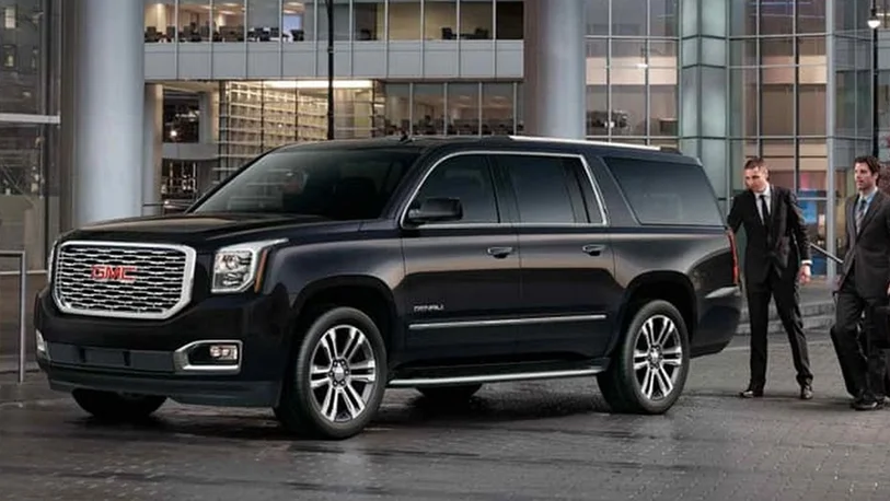 Corporate Limo Service with a Driver waiting for passengers